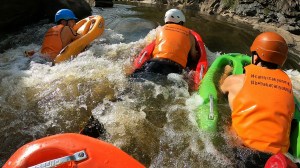 a person in a red raft in the water