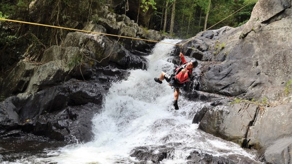 Having fun while abseiling cairns waterfalls