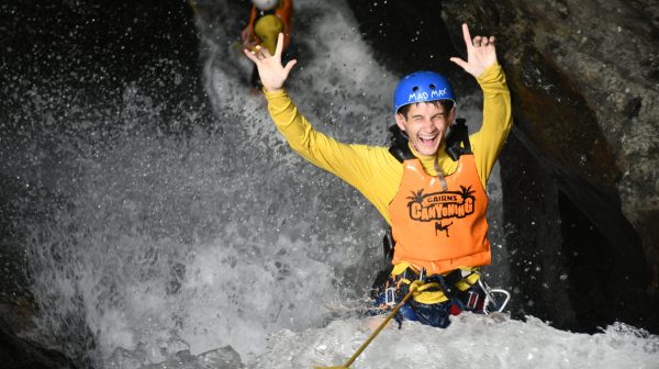 having fun abseiling cairns waterfalls in the rainforest at Crystal Canyon