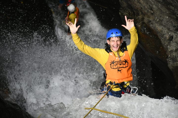 having fun abseiling cairns waterfalls in the rainforest at Crystal Canyon