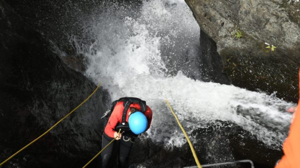 person exploring cairns waterfalls