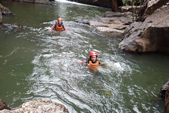 Participants on the Spillway Full Day Canyon Experience at a cairns waterfall