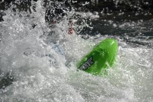 a man riding a wave on top of a body of water