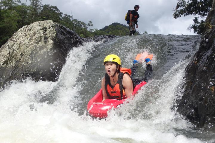 a person enjoying Barron Riverboarding cairns waterfalls