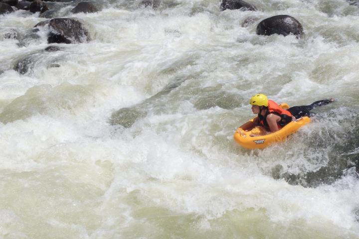 a person enjoying Barron Riverboarding cairns waterfalls