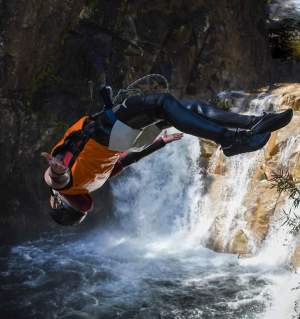 a man flying through the air while riding skis