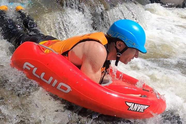 a person exploring the Barron Riverboarding in cairns waterfalls