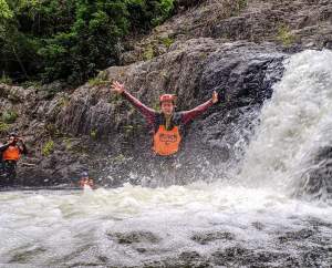 a man riding a wave on a surfboard in the water