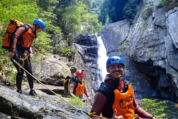 People exploring and having fun on the Crystal Cascades Canyoning Half Day Tour at Cairns waterfalls