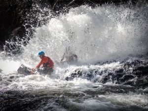 a man riding a wave on a surfboard in the water