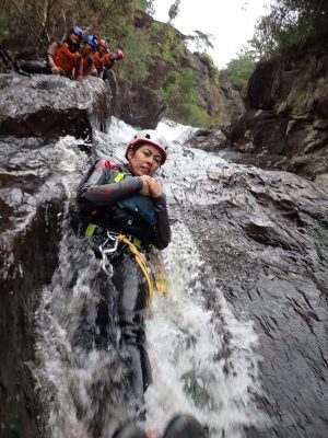 a man riding on the back of a waterfall