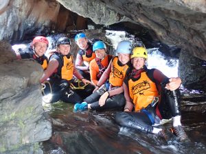 a group of people riding skis on a snowy mountain