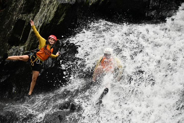 Having fun while abseiling cairns waterfalls